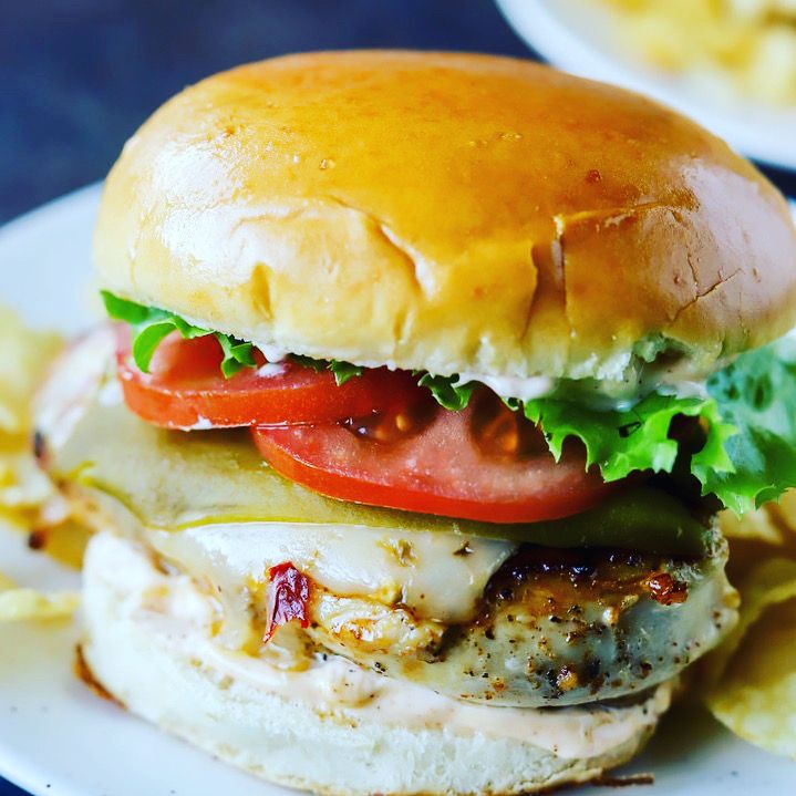 Grilled chicken wrap with lettuce, tomato and pickles