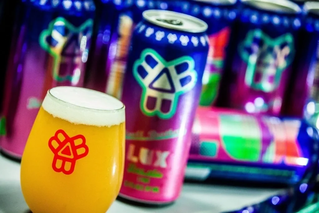 Craft beer cans and a fresh pour